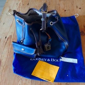 Dooney & Bourke    drawstring handbag  matching wallet.